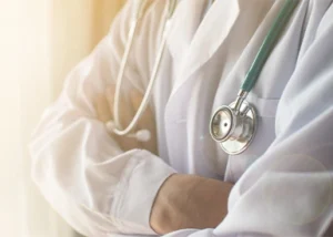 A doctor with a stethoscope around his neck.