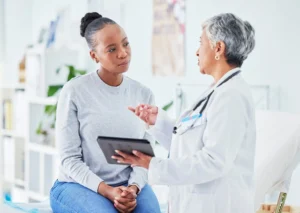 A doctor meeting with a patient.